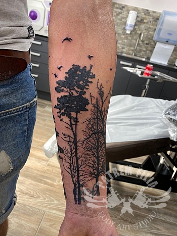 Bomen op onderarm