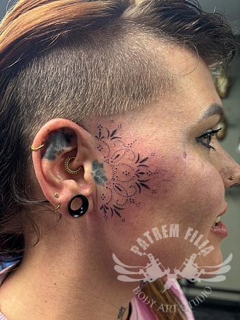 Side face tattoo